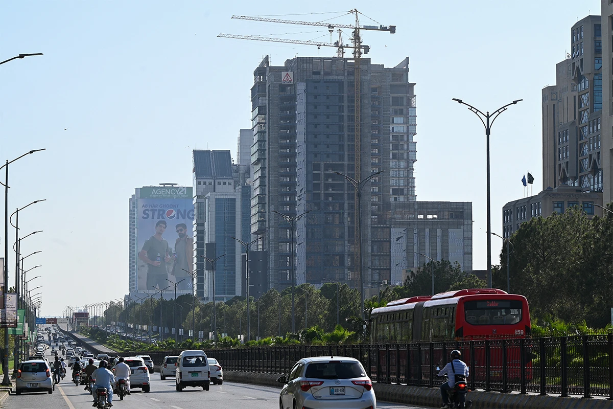 People commute on a road in Islamabad on July 11, 2023. (AFP/File)