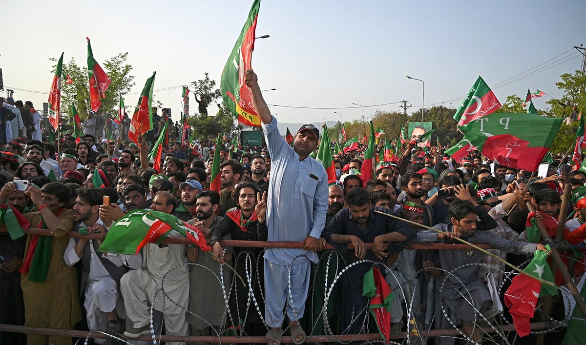 Supporters of ruling Pakistan Tehreek-e-Insaf (PTI) party attend a rally being addressed by Pakistan's Prime Minister Imran Khan, in Islamabad on March 27, 2022. (AFP/File)