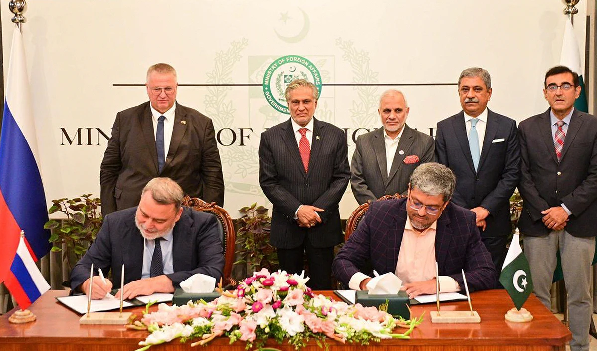 Pakistan Deputy Prime Minister Ishaq Dar (2L) gestures with his Russian counterpart Alexey Overchuk (L) during the signing of an MOU of bilateral cooperation in economy and trade at the Ministry of Foreign Affairs in Islamabad on September 18, 2024. (Photo courtesy: MOFA)