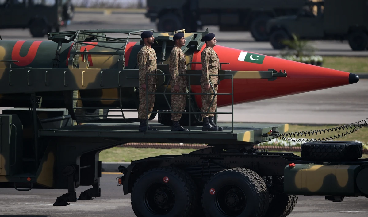 Pakistani military personnel stand beside a Ghauri nuclear-capable missile during a Pakistan Day military parade in Islamabad on March 23, 2017. (AFP/File)