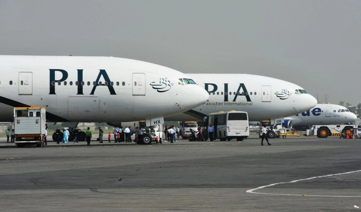 Pakistan International Airline (PIA) planes are positioned on the tarmac at the Benazir Bhutto International Airport in Islamabad on October 10, 2012. (AFP/File)