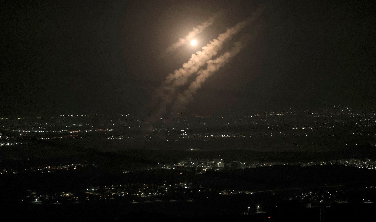 This picture taken from the West Bank city of Hebron shows projectiles above the Israeli city of Ashdod on October 1, 2024. (AFP)