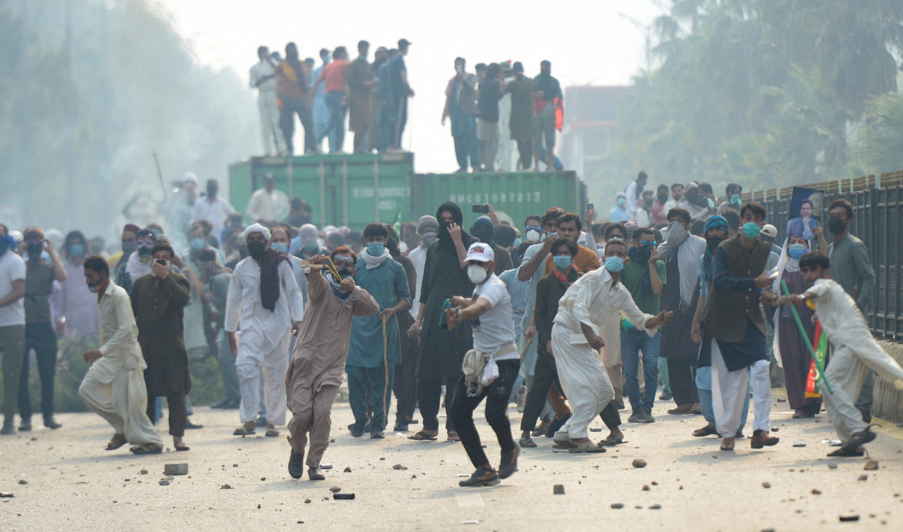 Supporters of jailed former Pakistani Prime Minister Imran Khan's party, the Pakistan Tehreek-e-Insaf (PTI) throw stones during an anti-government rally in Islamabad, Pakistan, October 5, 2024. (REUTERS)