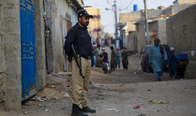 A police personnel stands guard during a search operation to identify alleged illegal immigrants, on the outskirts of Karachi on November 17, 2023. (AFP/File)