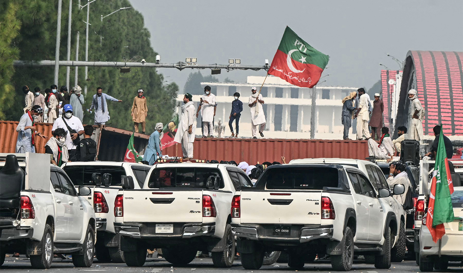 Supporters and activists of former Prime Minister Imran Khan's Pakistan Tehreek-e-Insaf (PTI) block a road during a protest in Islamabad on October 5, 2024. (AFP/File)