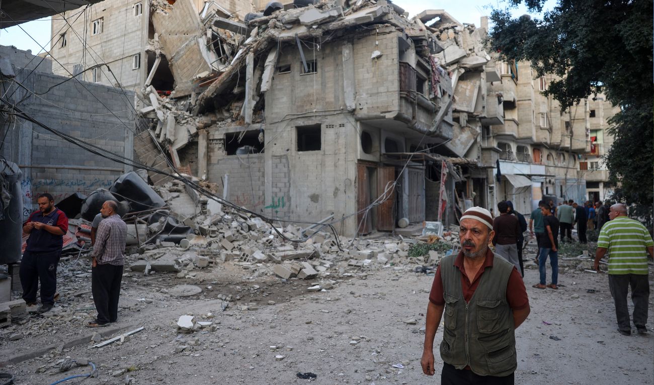 People inspect the damage following an Israeli air strike the previous night on the Bureij refugee camp in the central Gaza Strip on October 8, 2024, amid the continuing war between Israel and the Palestinian militant group Hamas. (AFP/File)