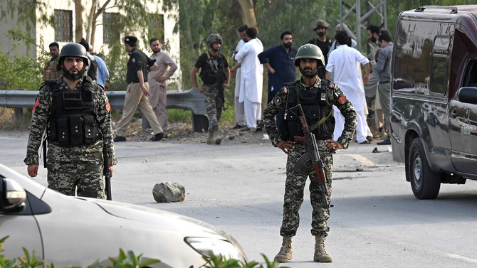 In this file photo, taken on July 18, 2023, Pakistani security personnel stand guard at the Hayatabad area of Peshawar. (AFP/File)