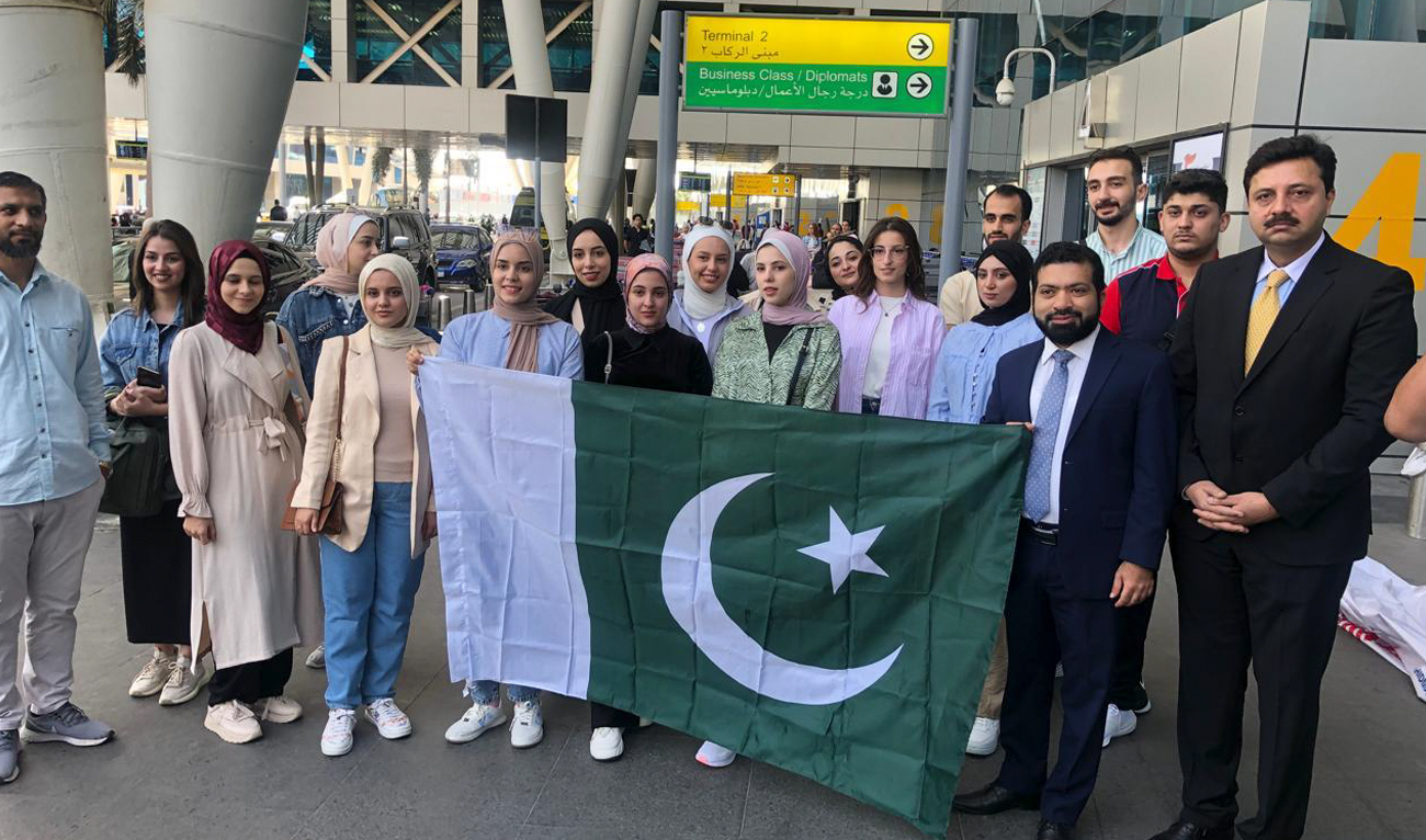 This handout photo, taken and released by Pakistan embassy in Egypt, shows first group of Palestinian students departing for Pakistan, in Cairo on October 12, 2024. (Photo courtesy: @PakinEgypt)