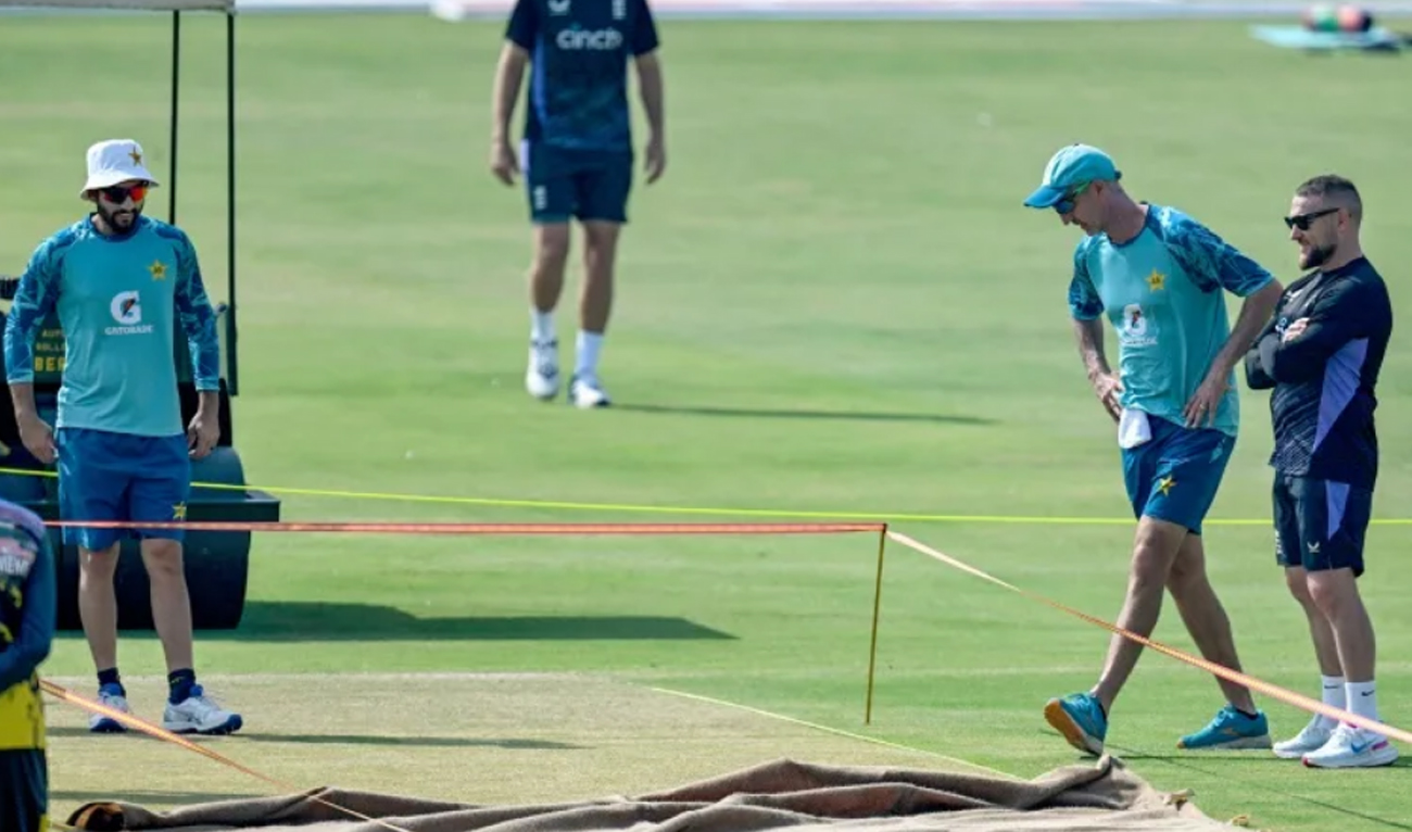 England’s head coach Brendon McCullum (R) and his Pakistani counterpart Jason Gillespie (2R) inspect the pitch during a practice session on the eve of their first Test cricket match at the Multan Cricket Stadium in Multan on October 6, 2024. (AFP/File)