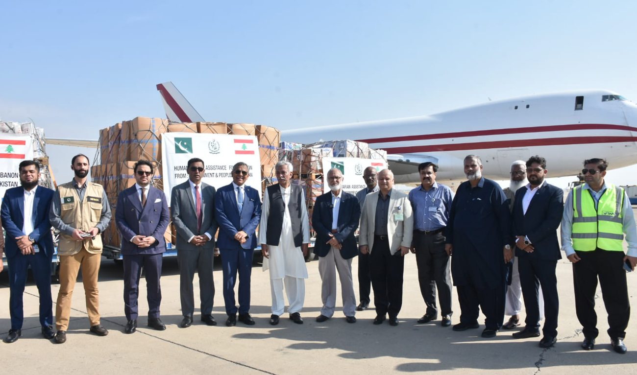 Pakistan’s National Disaster Management Authority officials gesture for a group photo as Pakistan dispatches relief aid to Lebanon, in Karachi on October 16, 2024. (Photo courtesy: NDMA)