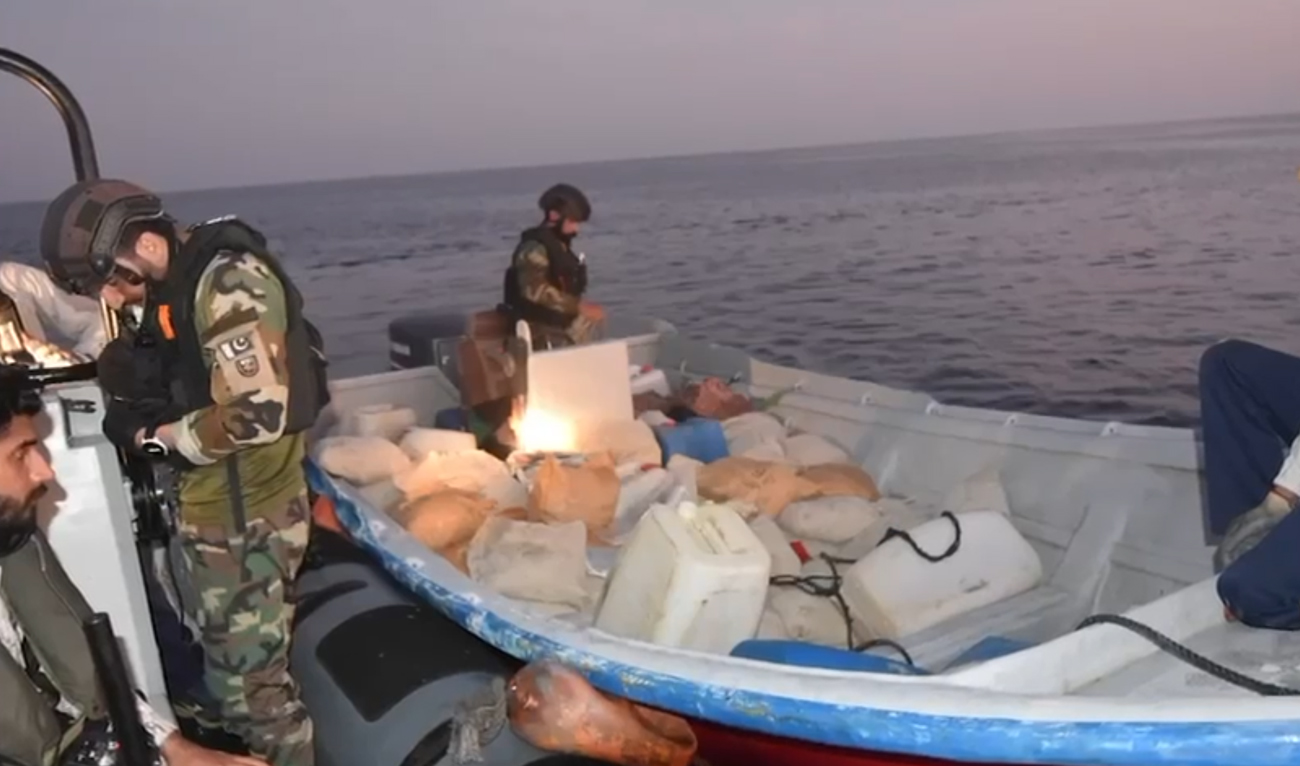 This screengrab, taken from a handout video released by Pakistan Navy shared on October 17, 2024, shows Pakistan Navy personnel seizing drugs during a targeted operation in the North Arabian Sea. (Photo courtesy: Pakistan Navy)