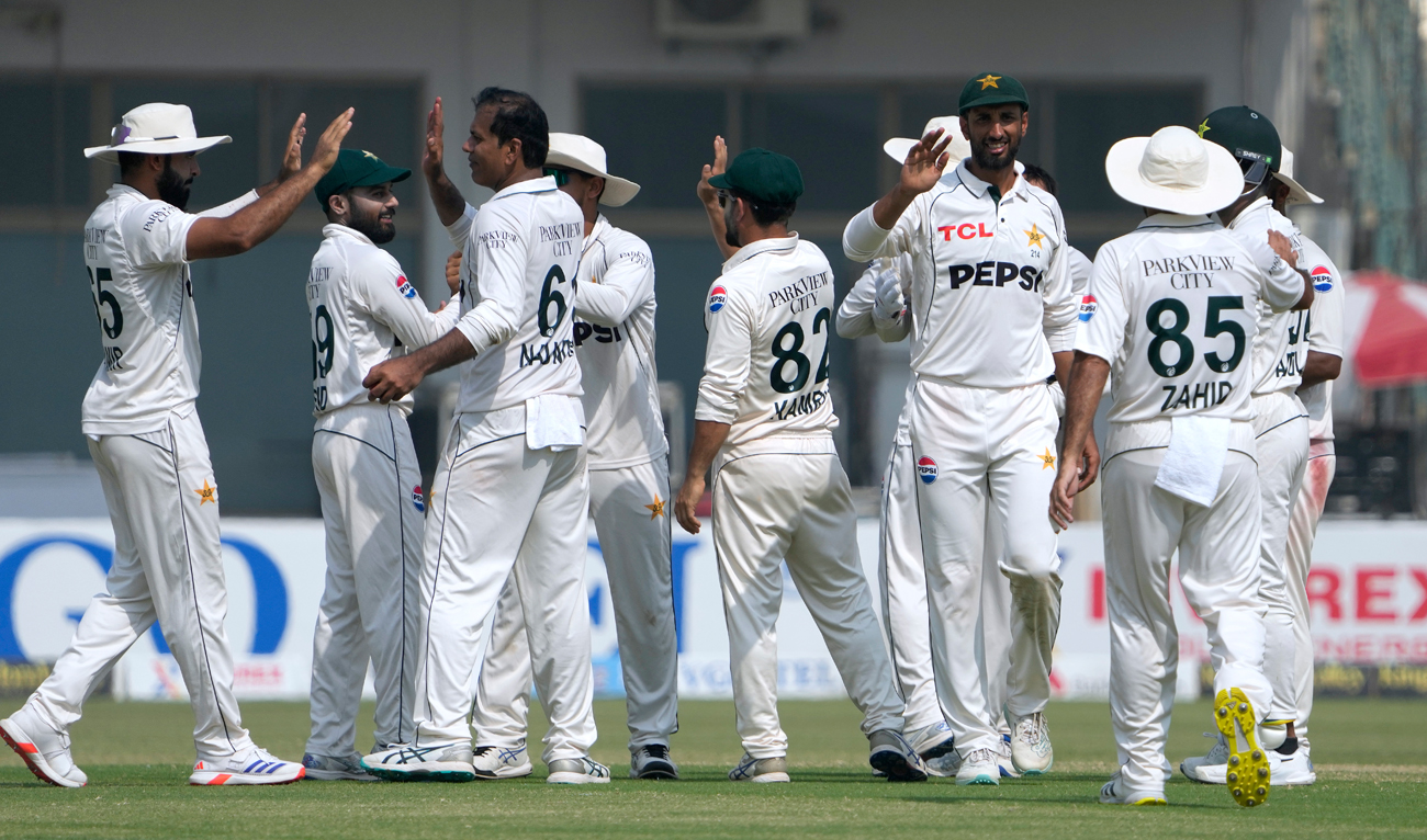 Pakistan’s Noman Ali, third left, and teammates celebrates after winning the second test cricket match against England, in Multan on October 18, 2024. (AP)