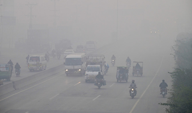 Commuters drive along a road amid dense smog in Lahore, Pakistan on November 24, 2023. (AFP/ File)