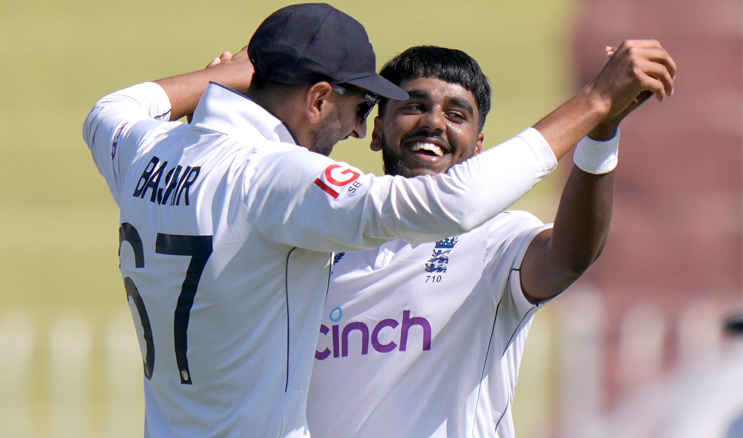 England's Rehan Ahmed, right, celebrates with teammate after taking the wicket of Pakistan's Aamer Jamal during the day two of third test cricket match between Pakistan and England, in Rawalpindi, Pakistan, on October 25, 2024. (AP)
