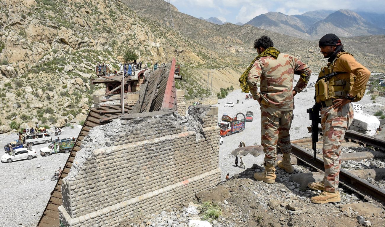 Security personnel inspect a collapsed railway bridge the morning after a blast by separatist militants at Kolpur in Bolan district, Balochistan province on August 27, 2024. (AFP/File)