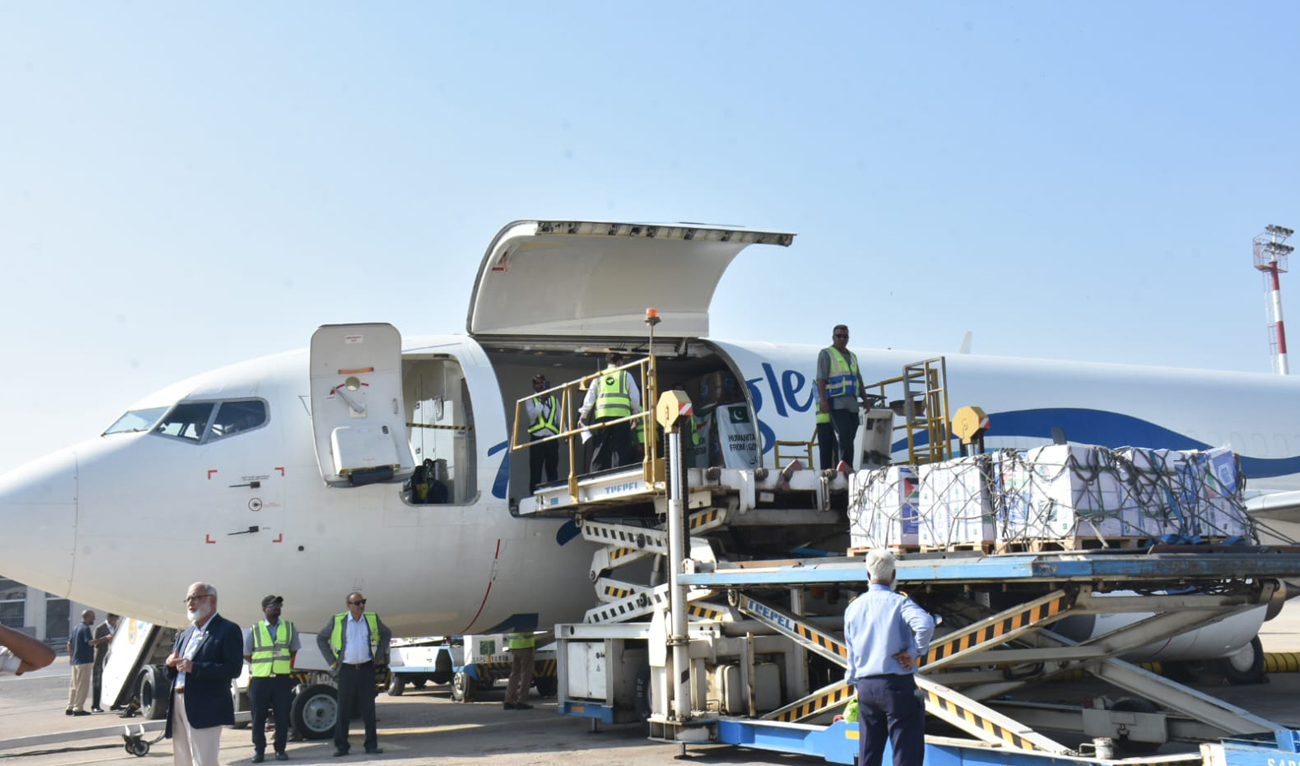 In this handout photo, taken and released by Pakistan’s National Disaster Management Authority on October 27, 2024, airport officials load consignment of relief goods being dispatched to Lebanon, in Karachi. (Photo courtesy: NDMA)
