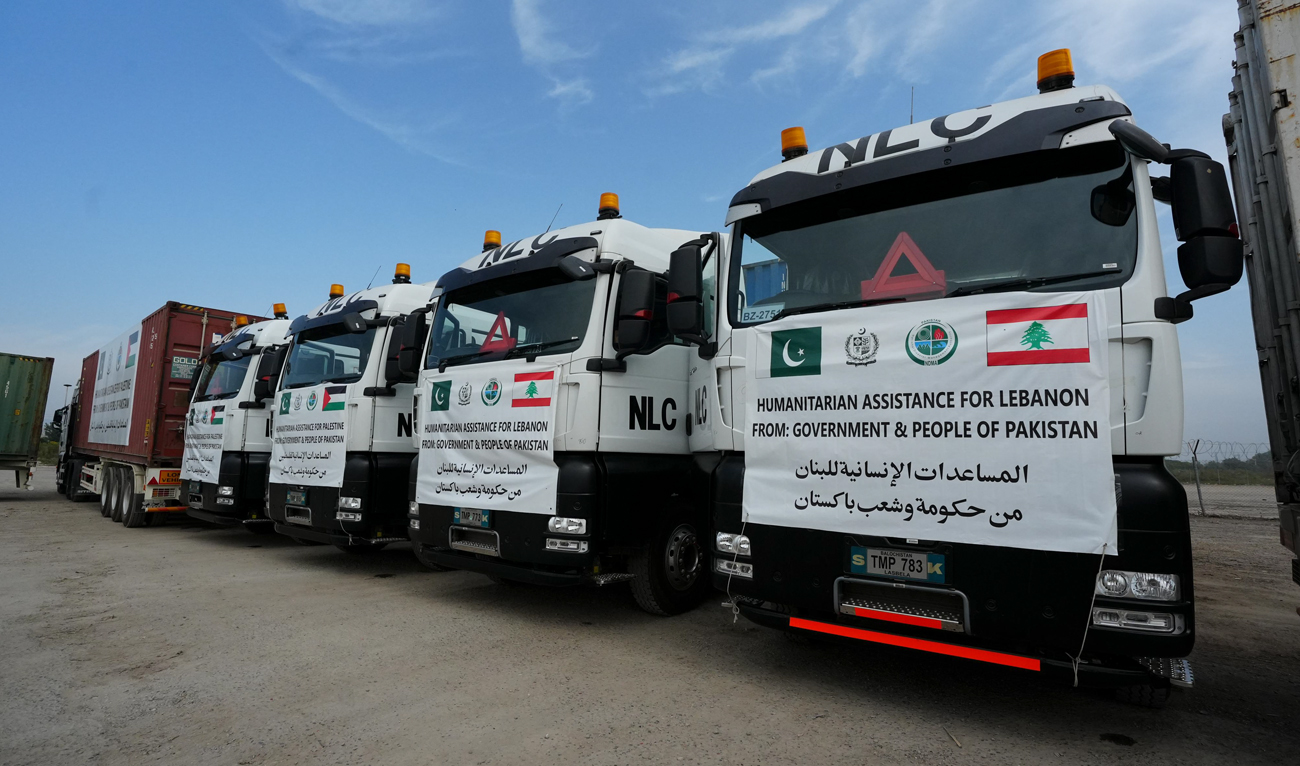This handout photo, taken and released by Pakistan’s National Disaster Management Authority on October 27, 2024, shows trucks of relief goods being dispatched to Gaza and Lebanon, in Islamabad. (Photo courtesy: NDMA)