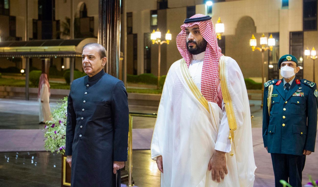 A handout picture provided by the Saudi Royal Palace shows Saudi Arabia's Crown Prince Mohammed Bin Salman (R) welcoming Pakistani Prime Minister Shehbaz Sharif in Jeddah on April 30, 2022. (AFP/File)