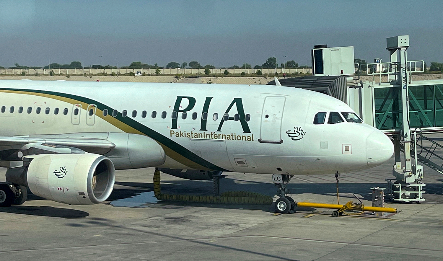 View of the Pakistan International Airlines (PIA) passenger plane, taken through a glass panel, at Islamabad International Airport, in Islamabad, Pakistan, on October 3, 2023. (REUTERS/File)