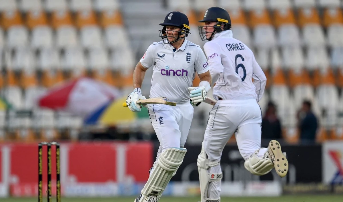 England's Joe Root and Zak Crawley (R) run between the wickets during the second day of the first Test cricket match between Pakistan and England at the Multan Cricket Stadium in Multan on October 8, 2024. (AFP)