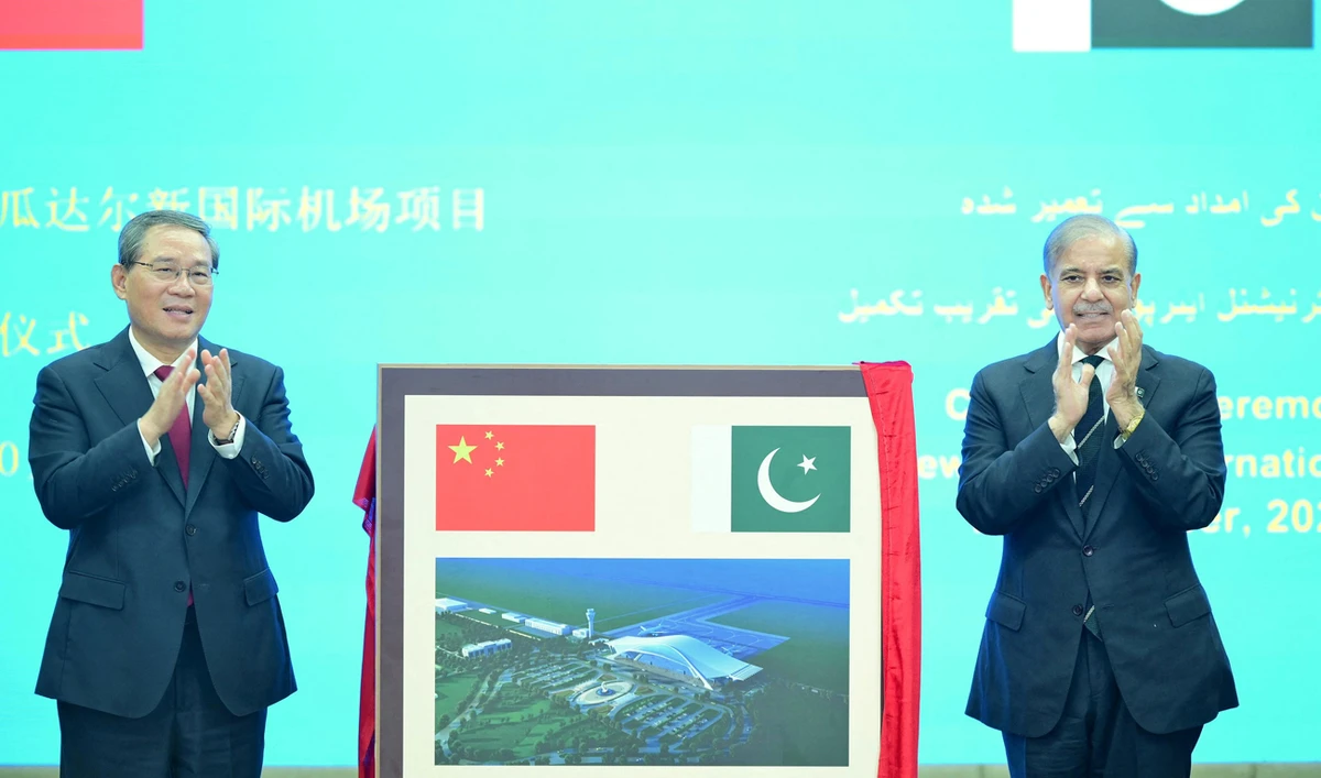 Chinese Premier Li Qiang and Pakistan’s Prime Minister Shehbaz Sharif react after unveiling a plaque to mark the completion of the New Gwadar International Airport, during a ceremony at the Prime Minister’s House in Islamabad on October 14, 2024. (Prime Minister’s House/Handout via REUTERS)