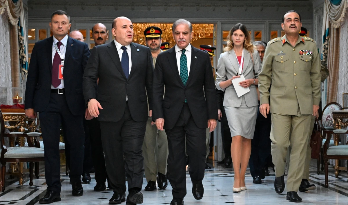 Russian Prime Minister Mikhail Mishustin, 2nd left, and Pakistani Prime Minister Shehbaz Sharif, 3rd left, walk prior to their meeting on the sidelines of Shanghai Cooperation Organization (SCO) Council of Heads of Governments Summit in Islamabad, Pakistan, Wednesday, Oct. 16, 2024. (Alexander Miridonov, Sputnik, Government Pool Photo via AP)