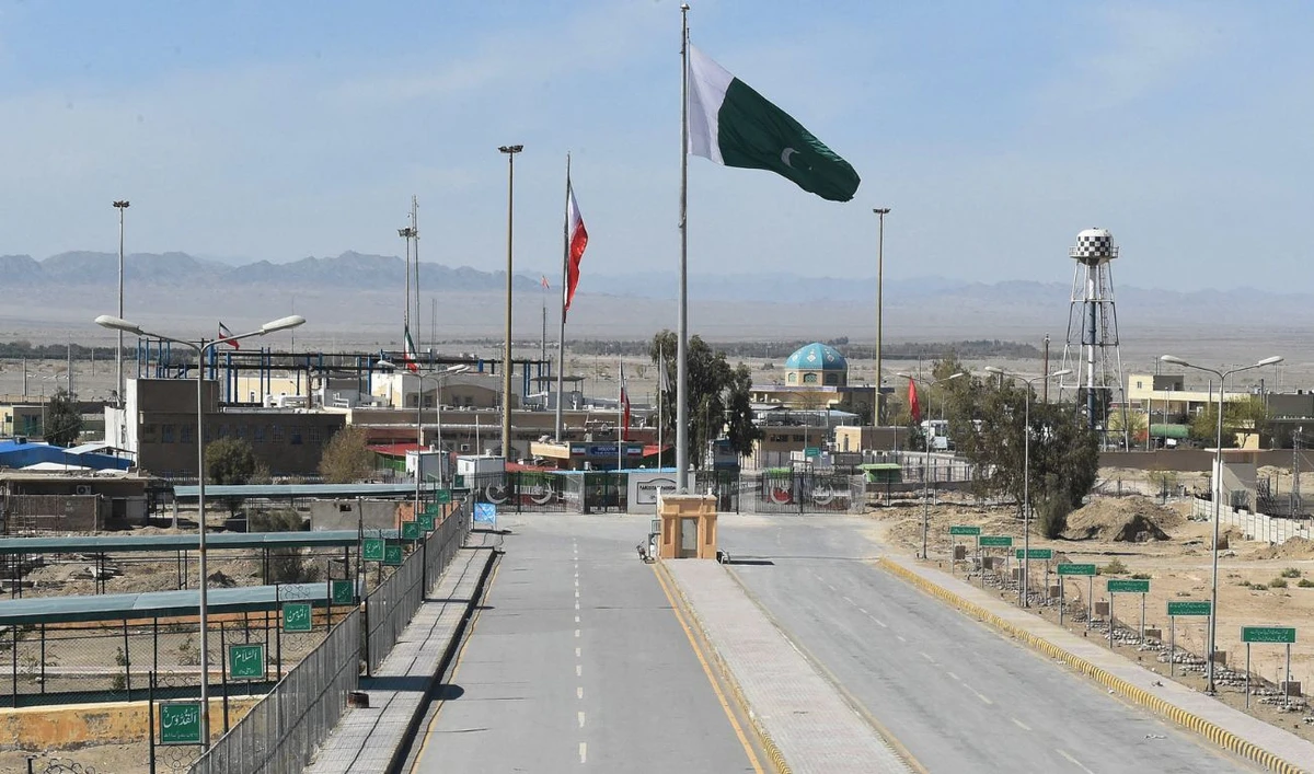 Pakistani and Iranian flags flutter on the closed Pakistan-Iran border in Taftan on February 25, 2020. (AFP/File)