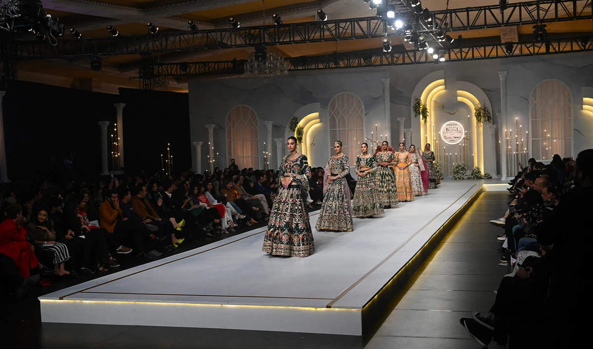 Models present creations by fashion designers Anaya and Horain during the Pantene HUM Bridal Couture Week, in Lahore on December 16, 2023. (AFP/File)