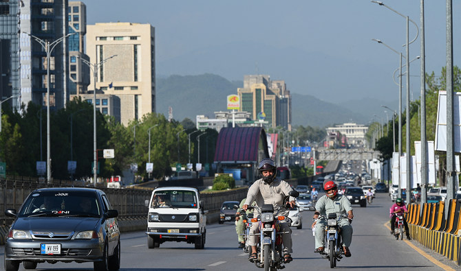 People commute on a road in Islamabad on July 11, 2023. (AFP/File)