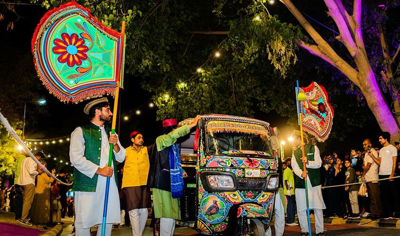 Pakistani performers stand next to rickshaws decorated with traditional truck art at Pakistan Week during the Riyadh Season at Al-Suwaidi Park in Riyadh, Saudi Arabia, on November 2, 2024. (across_cultures/Instagram)