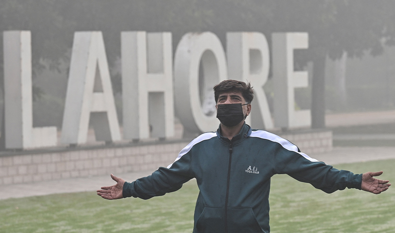 A man exercises in a park amid heavy smoggy conditions in Lahore, Pakistan, on November 7, 2024. (AFP)