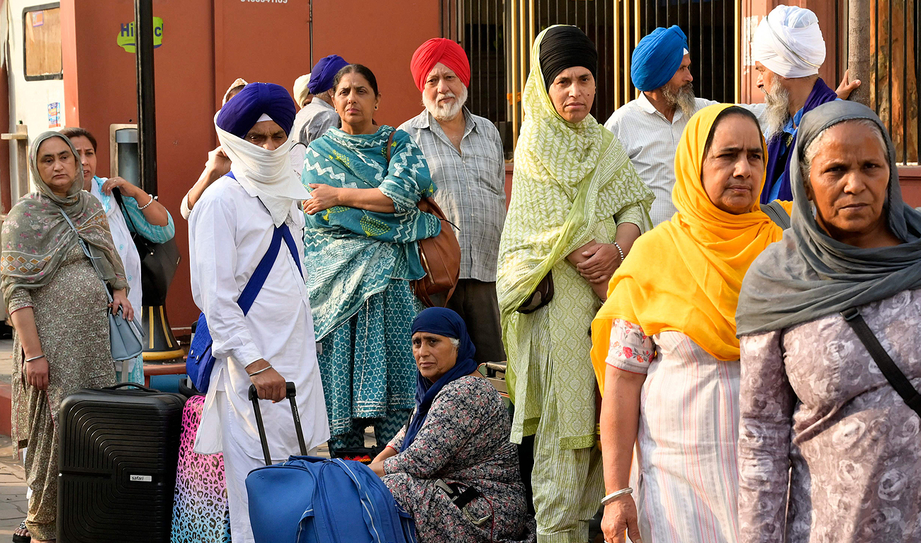 Sikh pilgrims wait for their bus before leaving for Pakistan to celebrate ‘Baisakhi’, a spring harvest festival, in Amritsar on April 13, 2024. (AFP/File)