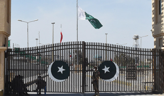 In this file picture, taken on February 25, 2020, Pakistani soldiers stand guard at the closed Pakistan-Iran border in Taftan. (AFP/File)