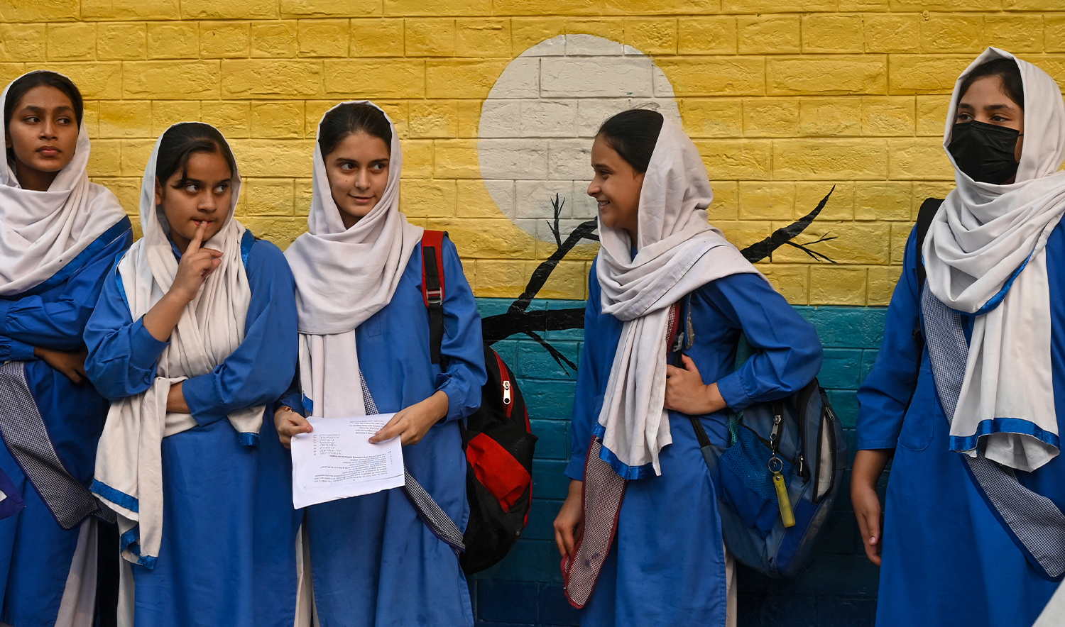 Students leave after attending their school in Lahore on November 6, 2024, as government authorities ordered closing all higher secondary schools over soaring pollution levels. (AFP/File)