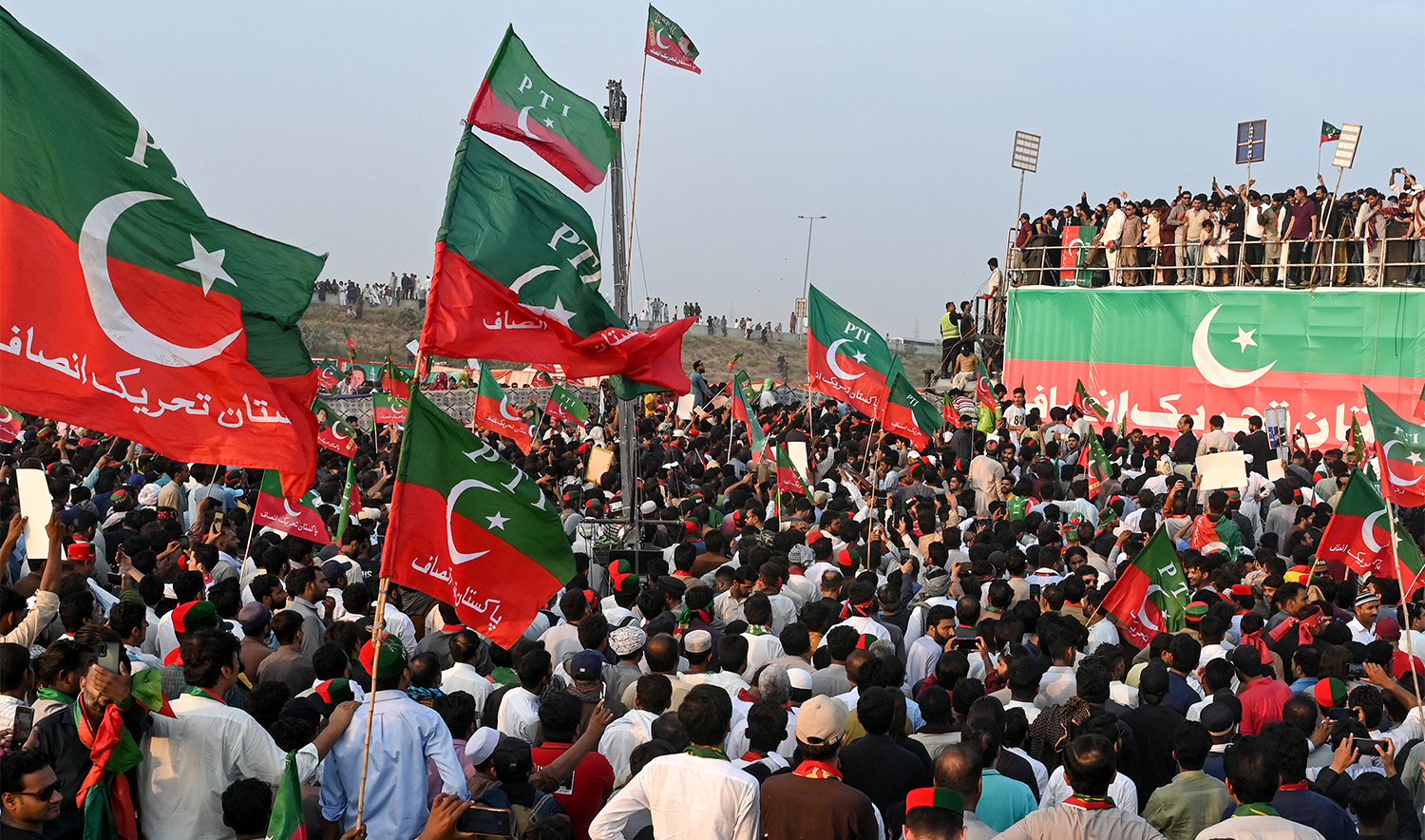 Activists of Pakistan Tehreek-e-Insaf (PTI) party of former country's prime minister Imran Khan, take part in a public rally on the outskirts of Lahore on September 21, 2024. (AFP/File)
