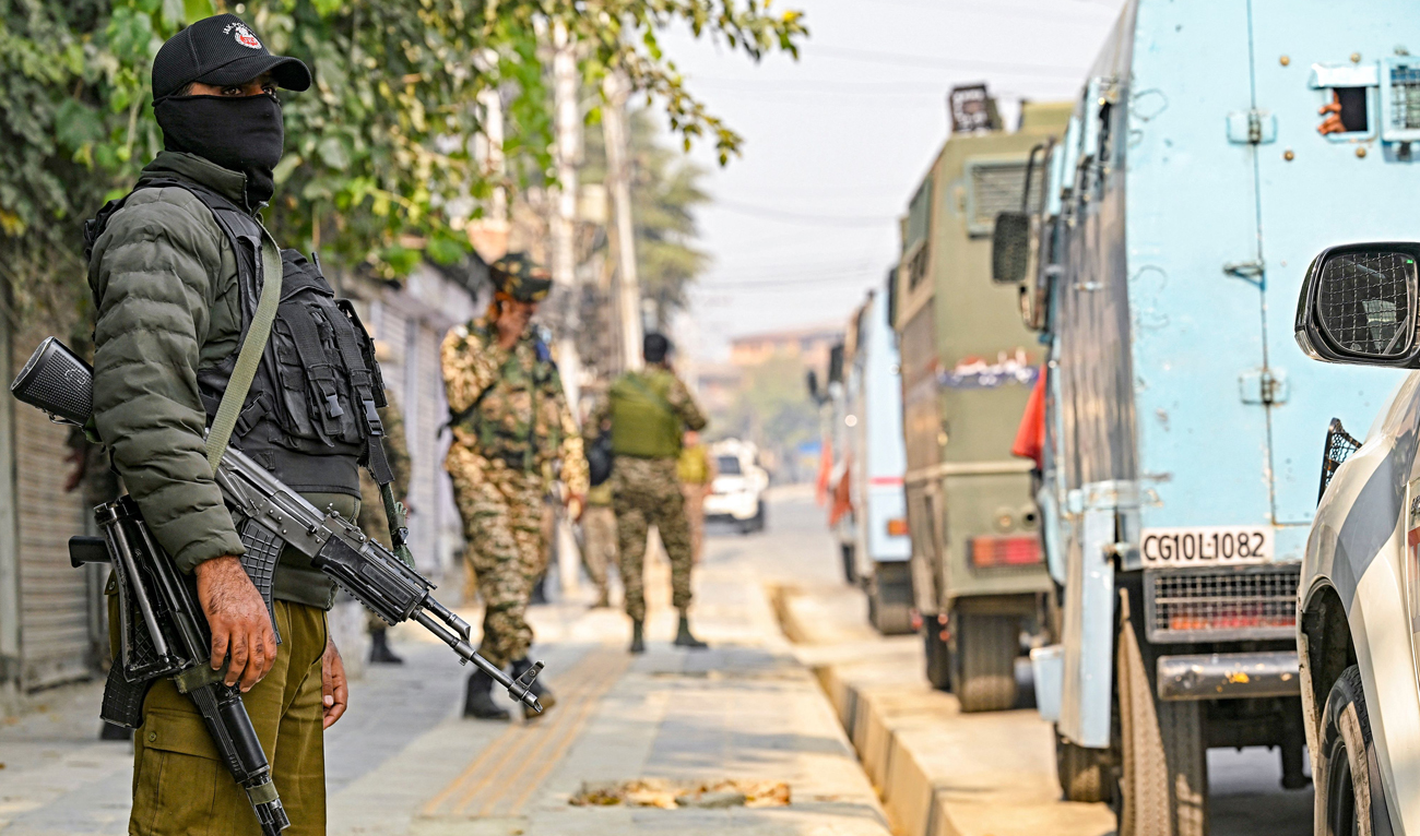 Indian security personnel stand guard near the site of a gunbattle between suspected militants and Indian forces in Srinagar on November 2, 2024. (AFP)