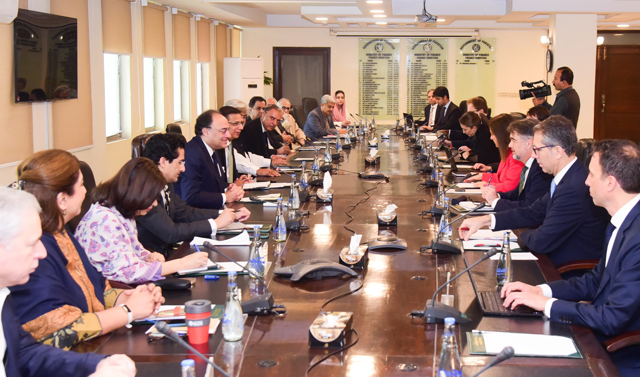 This handout photograph released by the Pakistan Press Information Department (PID) on November 12, 2024, shows Pakistan’s Finance Minister Muhammad Aurangzeb (5L) meeting with a International Monetary Fund (IMF) review mission led by Nathan Porter (3R) at the Finance Ministry in Islamabad on November 11, 2024. (PID/File)
