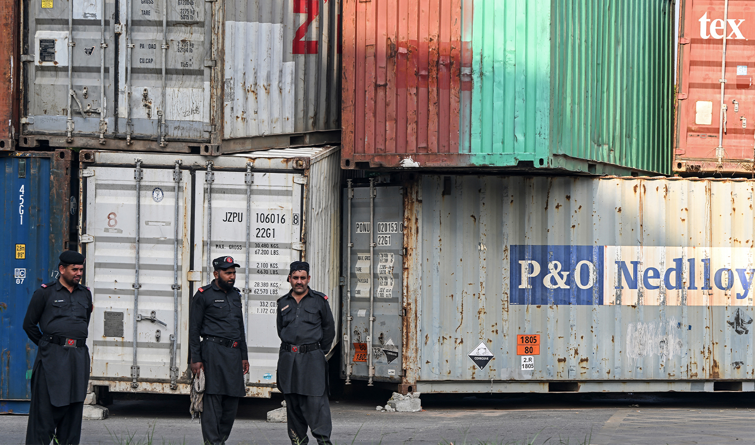 Pakistani Frontier Constabulary (FC) personnel stand guard in front of shipping containers after authorities blocked the road during a protest by the activists and supporters of former Prime Minister Imran Khan's Pakistan Tehreek-e-Insaf (PTI) party, in Islamabad on October 4, 2024. (AFP/File)