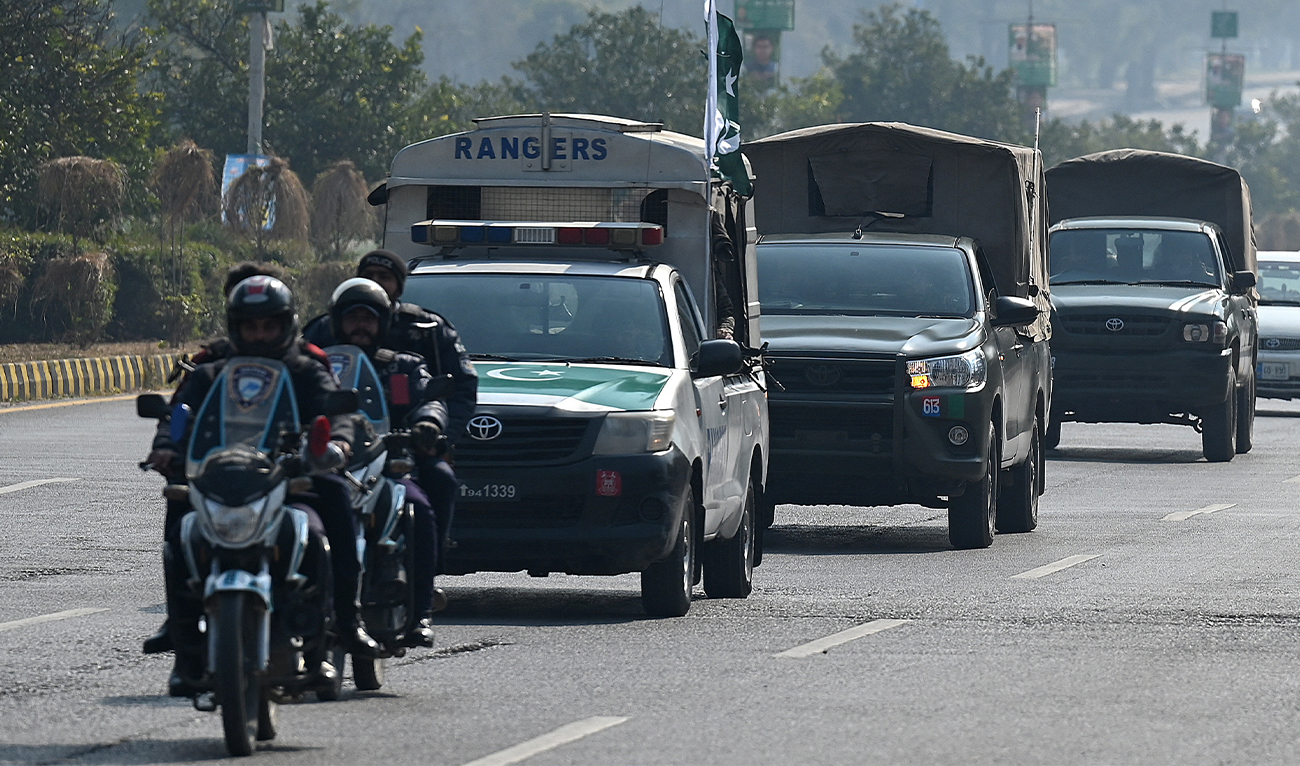 A convoy of security personnel patrols on a road in Islamabad, Pakistan on February 5, 2024. (AFP/File)