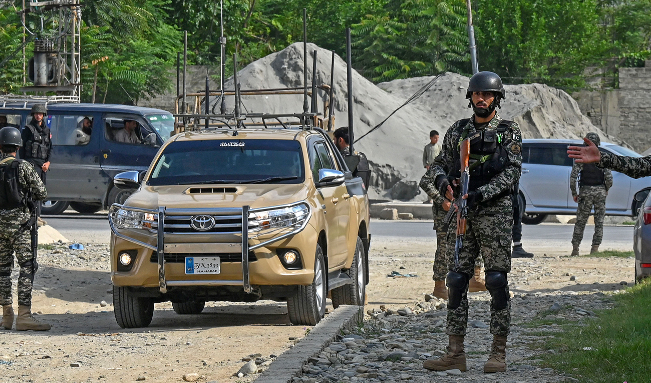 In this file photo, taken on July 31, 2023, security personnel stand guard at the site of a bomb blast in Bajaur district of Khyber-Pakhtunkhwa province. (AFP/File)