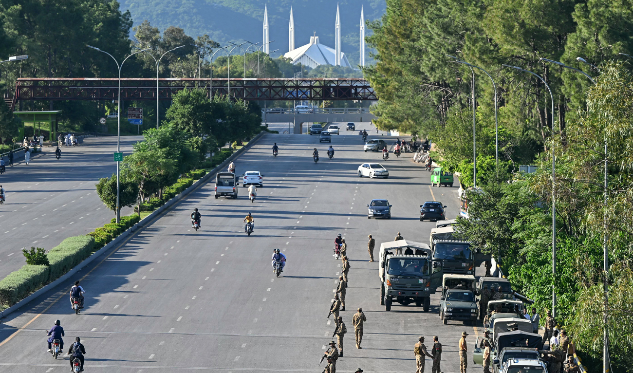 In this file photo, taken on October 6, 2024, Pakistan Army soldiers stand guard in anticipation of former Prime Minister Imran Khan’s supporters and activists amid the ongoing protests in Islamabad. (AFP/File)