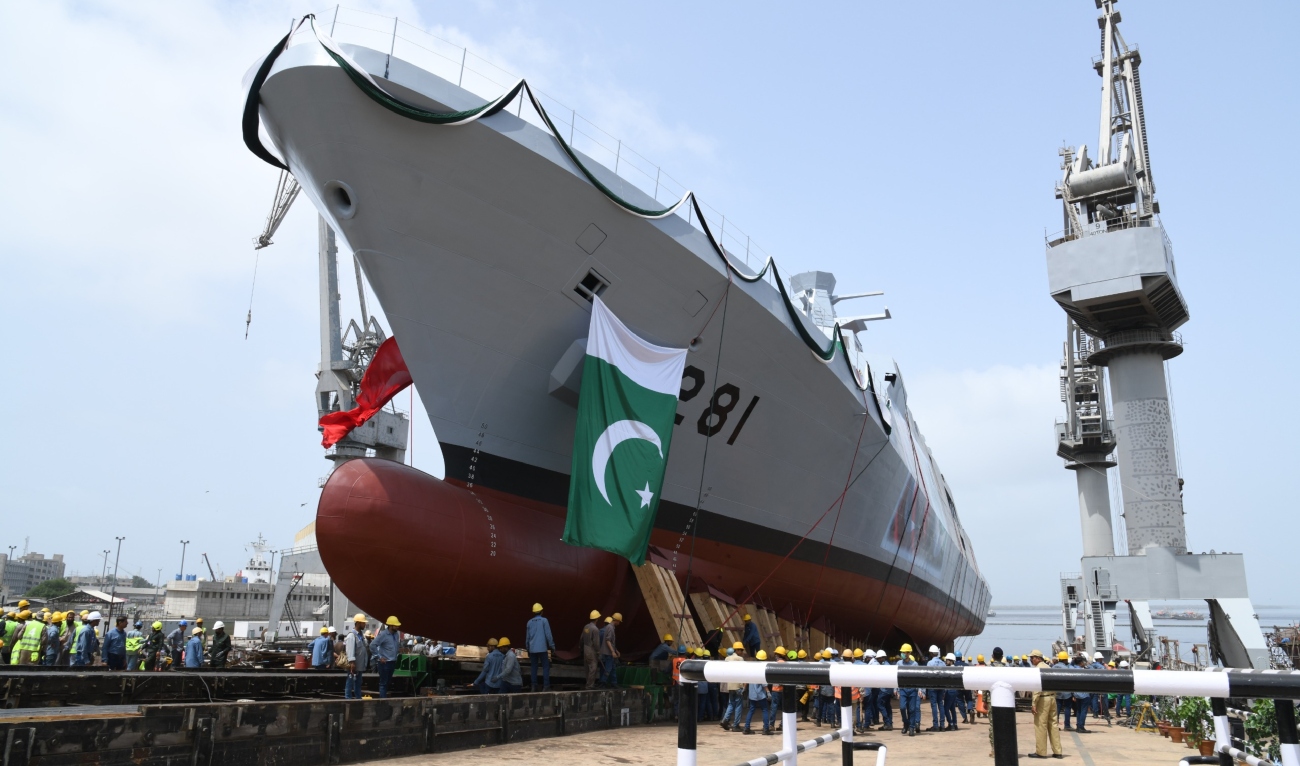 The picture shared by Pakistan Navy on November 27, 2024 shows workers standing next to a Pakistan Navy ship in Karachi. (Pakistan Navy)