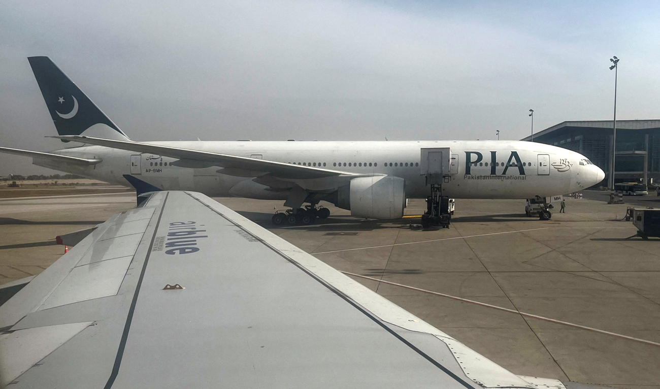 Pakistan International Airlines (PIA) passenger plane sits on tarmac, as seen through a plane window, at the Islamabad International Airport, Islamabad on October 27, 2024. (REUTERS/File)