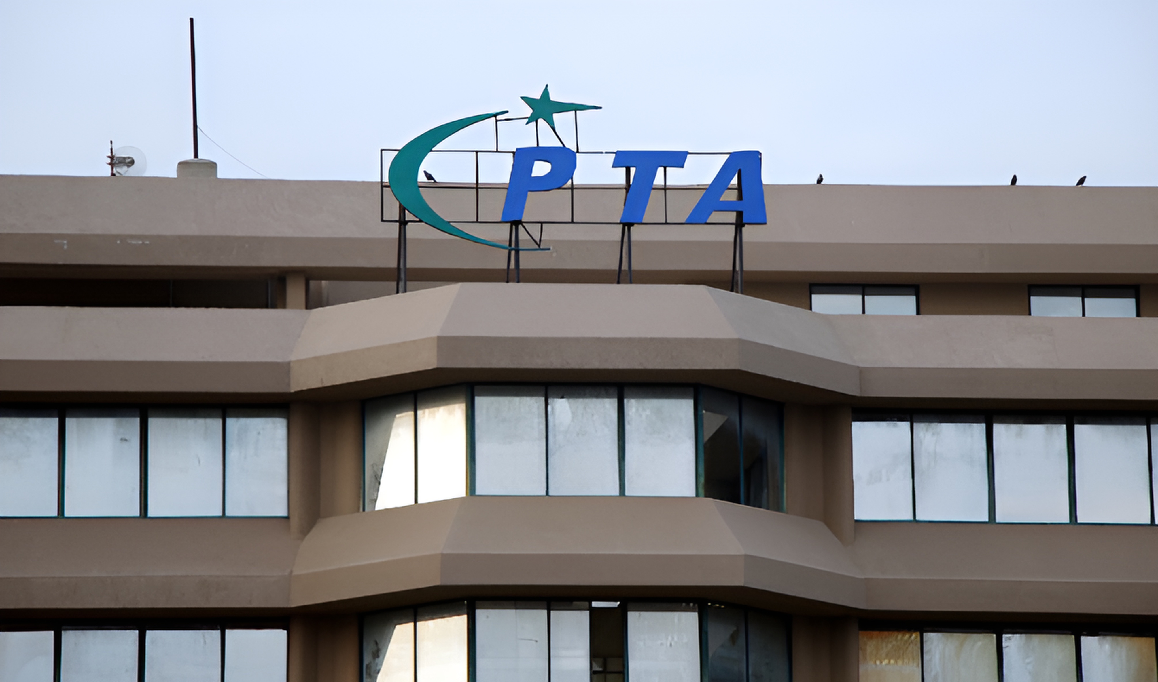 A logo of the Pakistan Telecommunication Authority (PTA) is seen on its headquarters building in Islamabad on August 16, 2024. (AFP/File)