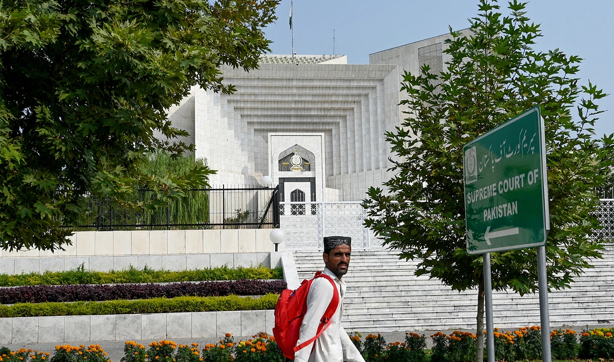 In this photograph taken on October 23, 2024, a man walks past the Pakistan's Supreme Court building in Islamabad. (AFP/File)