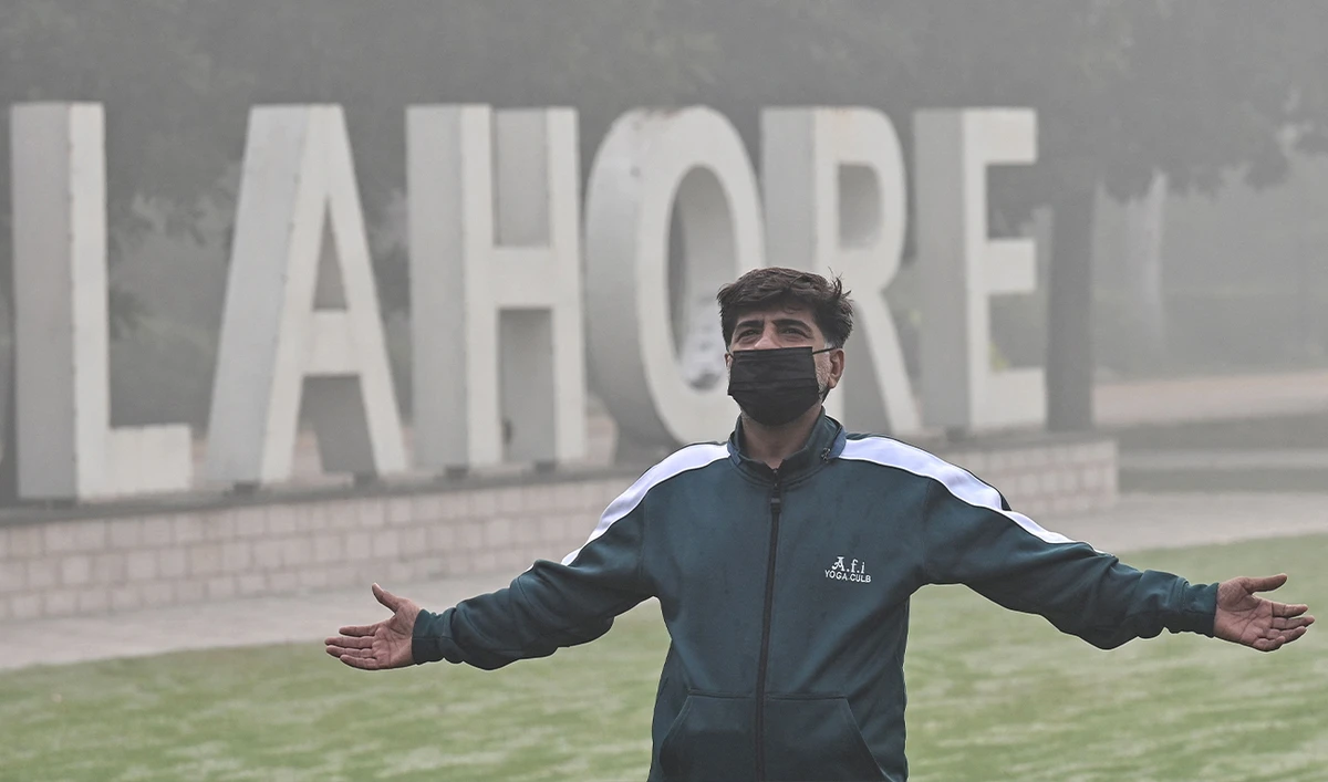 A man exercises in a park amid heavy smoggy conditions in Lahore, Pakistan, on November 7, 2024. (AFP)