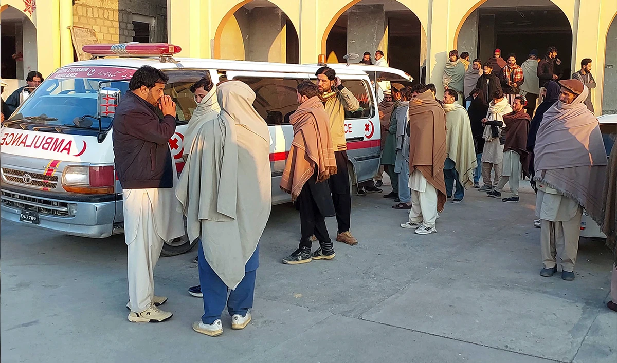 Relatives gather to collect the body of a person from hospital, who was killed in a gunmen firing incident in district Kurram, Pakistan, on November 22, 2024. (AP)