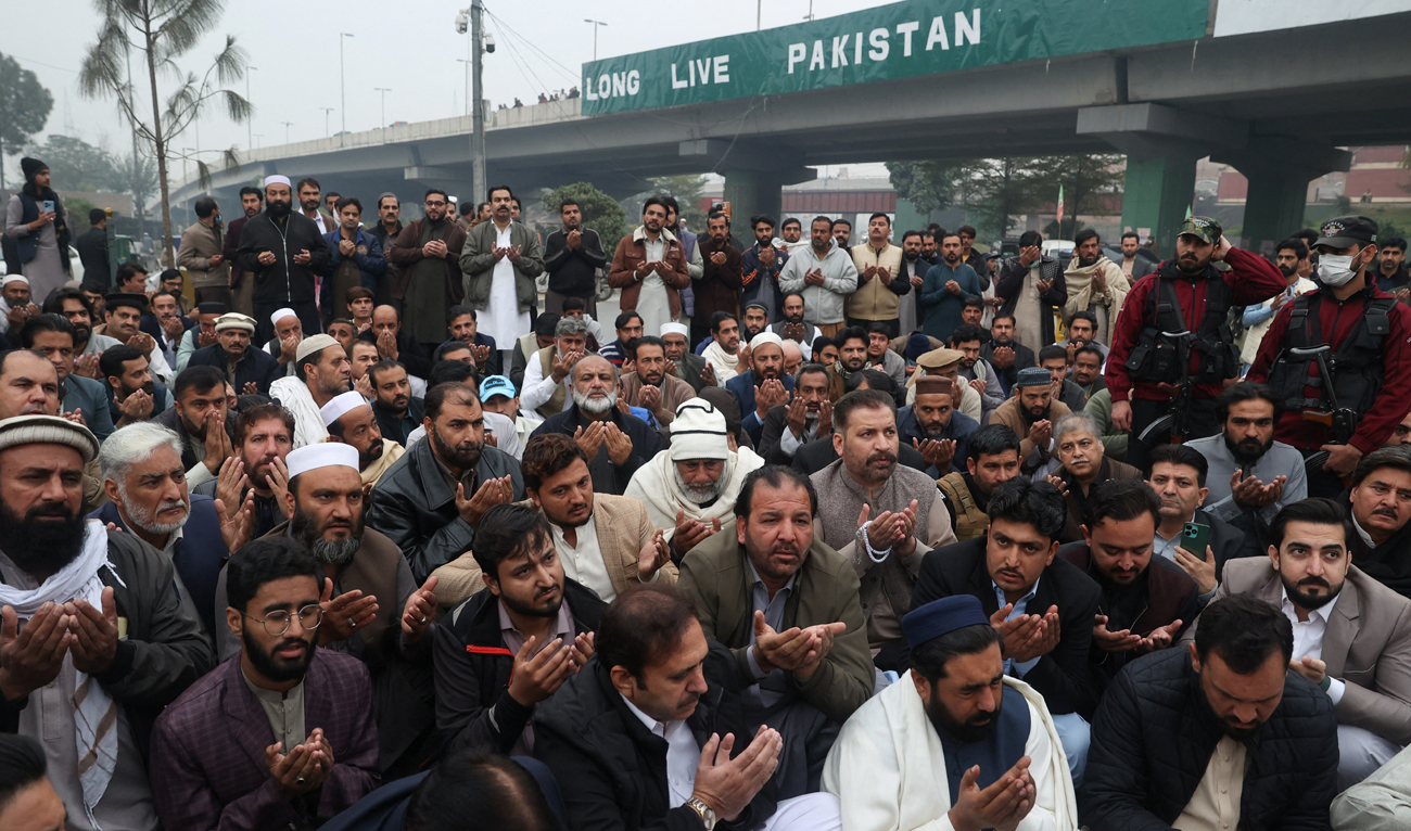 Supporters of the former Pakistani Prime Minister Imran Khan’s party, Pakistan Tehreek-e-Insaf (PTI), attend a symbolic prayer for the people the party claims were killed during a protest in Islamabad this week, in Peshawar on November 29, 2024. (REUTERS)