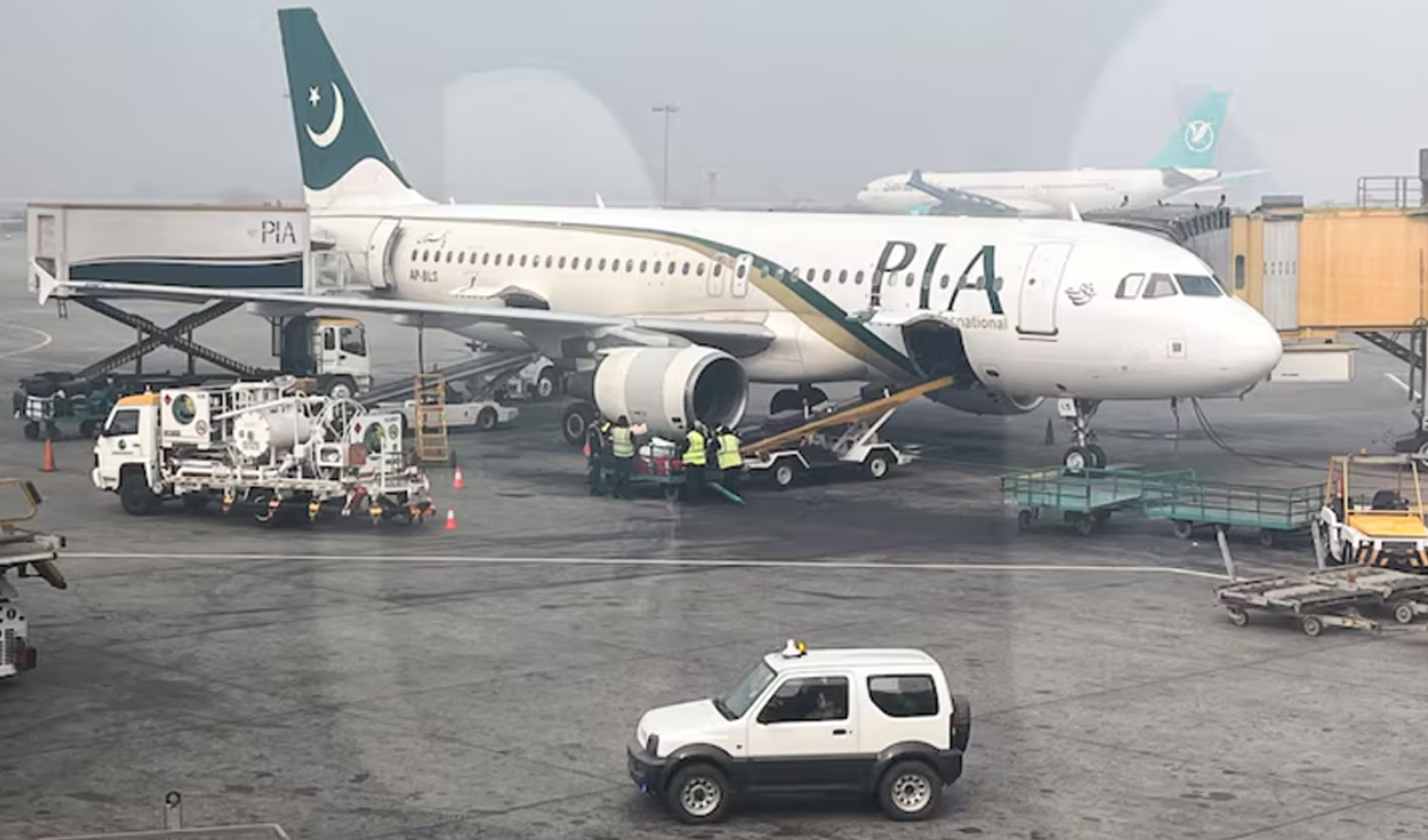 View of a Pakistan International Airlines (PIA) passengers plane, taken through a glass panel, at the Allama Iqbal International Airport in Lahore on January 29, 2024. (REUTERS/File)