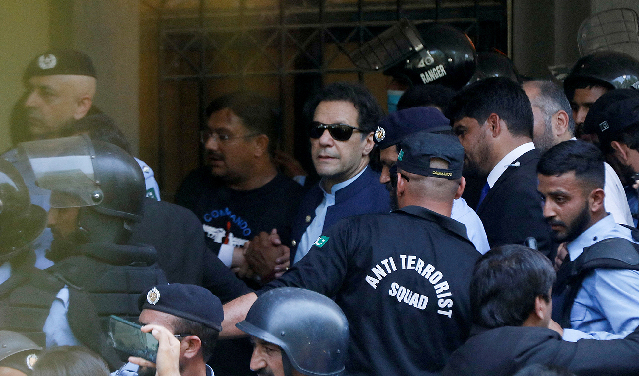 Security officers escort Pakistani former Prime Minister Imran Khan as he appeared in Islamabad High Court, Islamabad, Pakistan on May 12, 2023. (REUTERS/File)